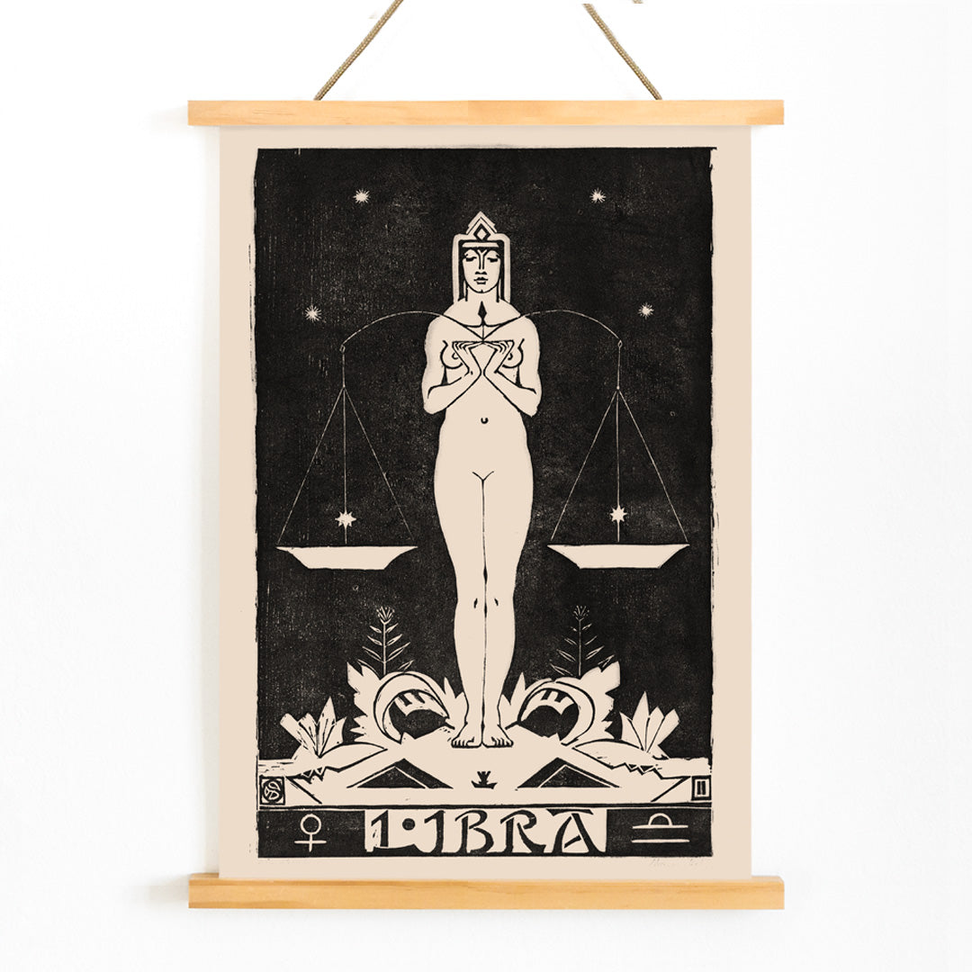 Art Nouveau Libra zodiac sign illustration by Henri van der Stok featuring a woman holding balanced scales and stars, with wooden magnetic frame on white background