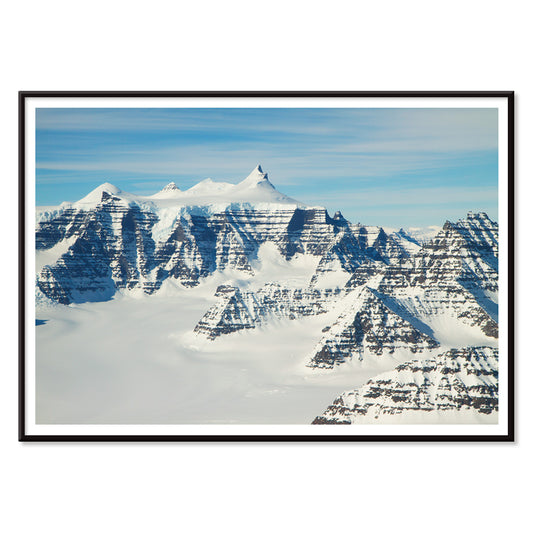 Snow covered mountain ridges and unique geology of the Geikie Plateau eastern Greenland by NASA poster, with black aluminium frame on white background