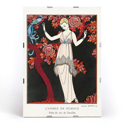Elegant woman in evening gown under flowering tree with bird by George Barbier from LArbre de science art deco poster, framed and displayed in modern living room decor
