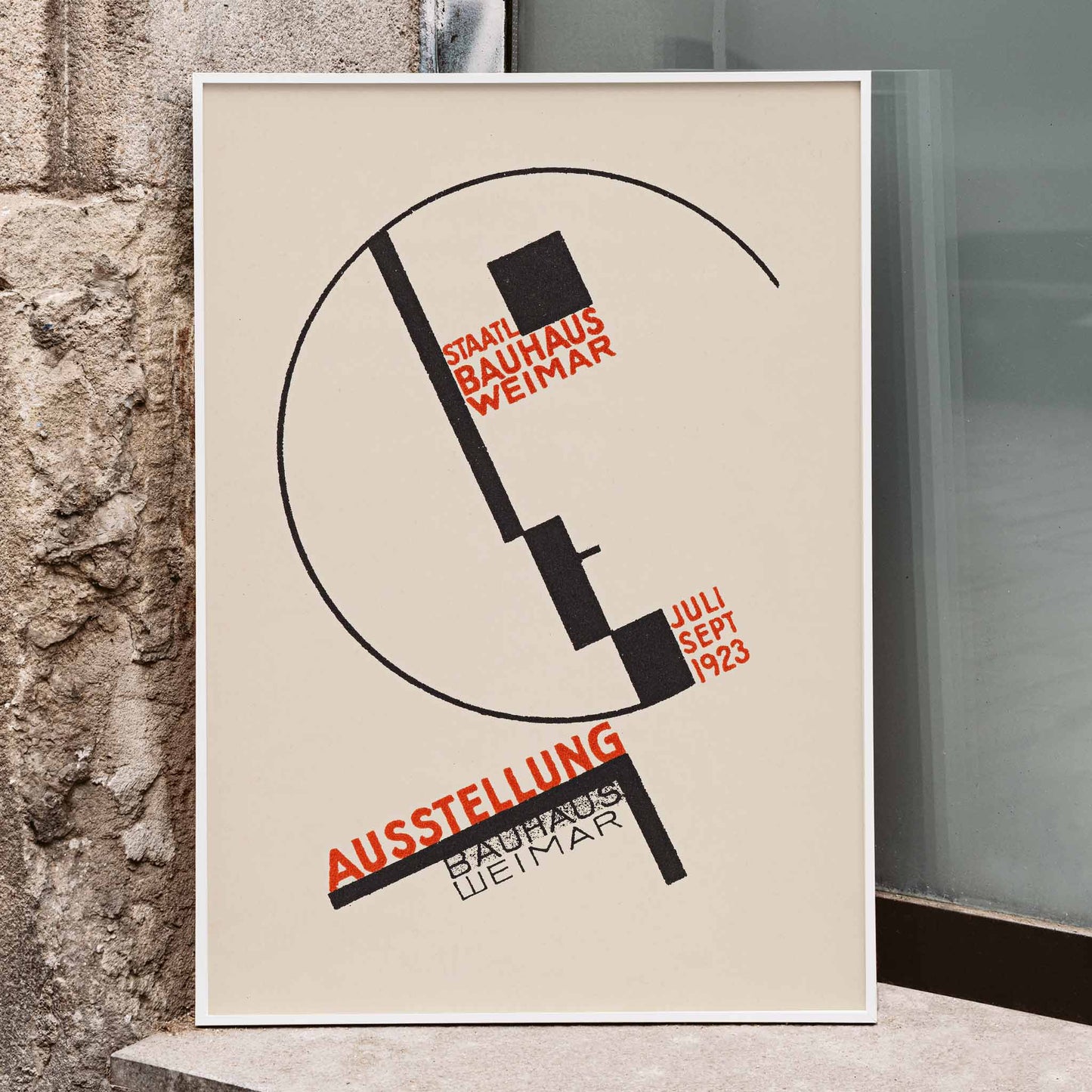 Dörte Helm Bauhaus Weimar exhibition poster with bold black geometry and red typography on warm beige background, framed and displayed in modern living room decor