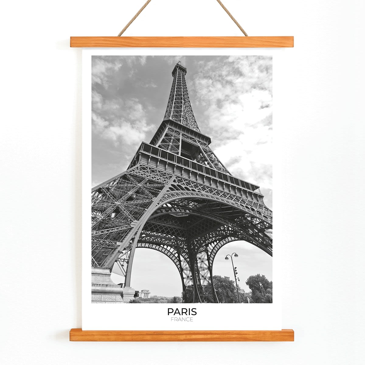 Black and white picture of the Eiffel Tower in Paris featuring its intricate structure by artist poster titled Tour Eiffel Black and White, with wooden magnetic frame on white background