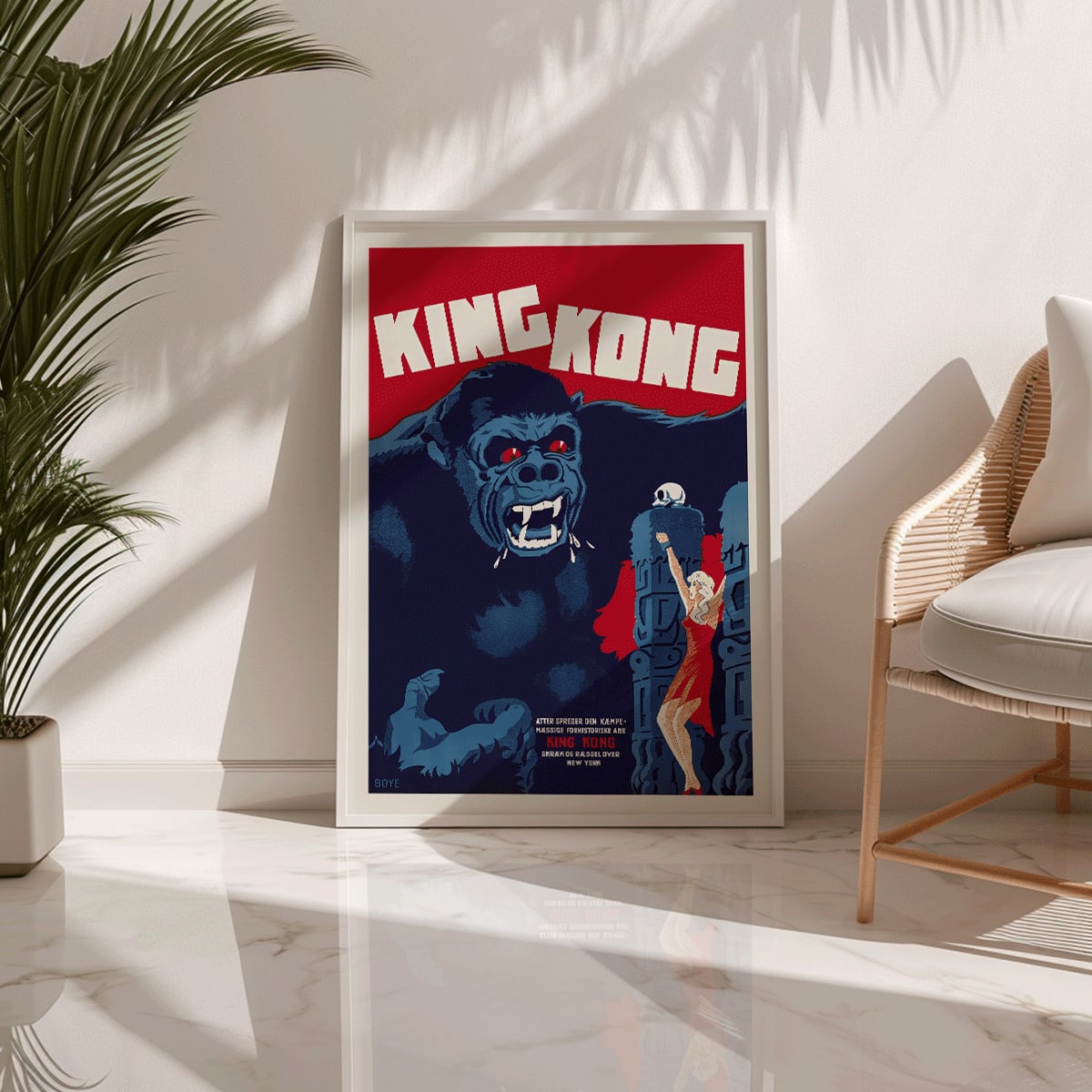 King Kong movie poster by Boye showing giant gorilla with red eyes grabbing a building and a woman in a red dress in an iconic scene, framed and displayed in home decor