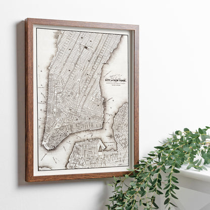 Vintage map of New York City showing detailed streets and layout from Library of Congress Geography and Map Division titled Map of the City of New York, framed and displayed in home decor