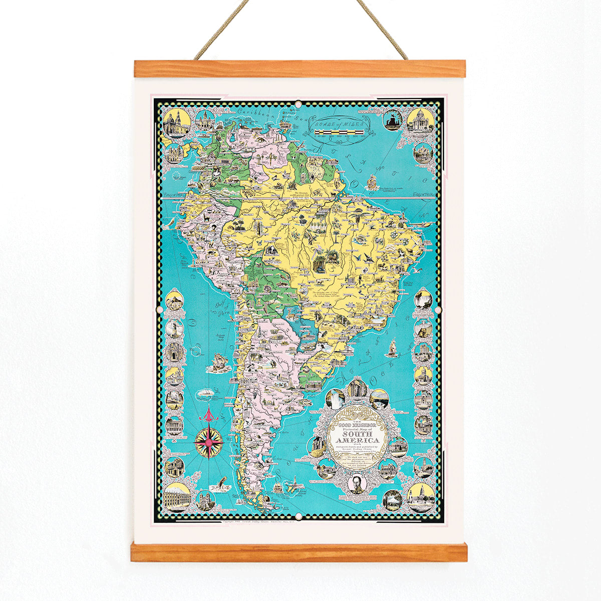 Colorful illustrated map poster of South America by Ernest Dudley Chase titled The Good Neighbor of South America, with wooden magnetic frame on white background