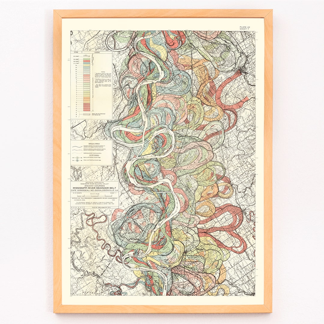 Colorful poster map of the Mississippi River by Harold Fisk titled Alluvial Valley of the Mississippi River showing historical meanders and vibrant river patterns, framed and displayed in modern living room decor