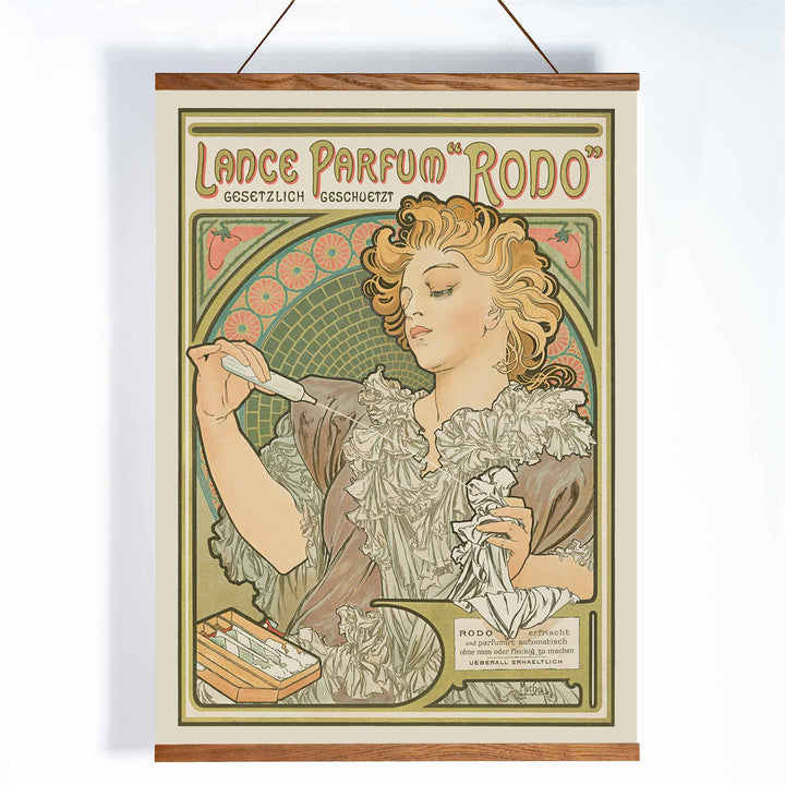 Alphonse Mucha Lance parfum Rodo poster Art Nouveau woman with flowing hair floral border soft green gold tones, with wooden magnetic frame on white background