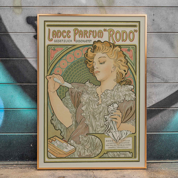 Alphonse Mucha Lance parfum Rodo poster Art Nouveau woman with flowing hair floral border soft green gold tones, framed and displayed in home decor