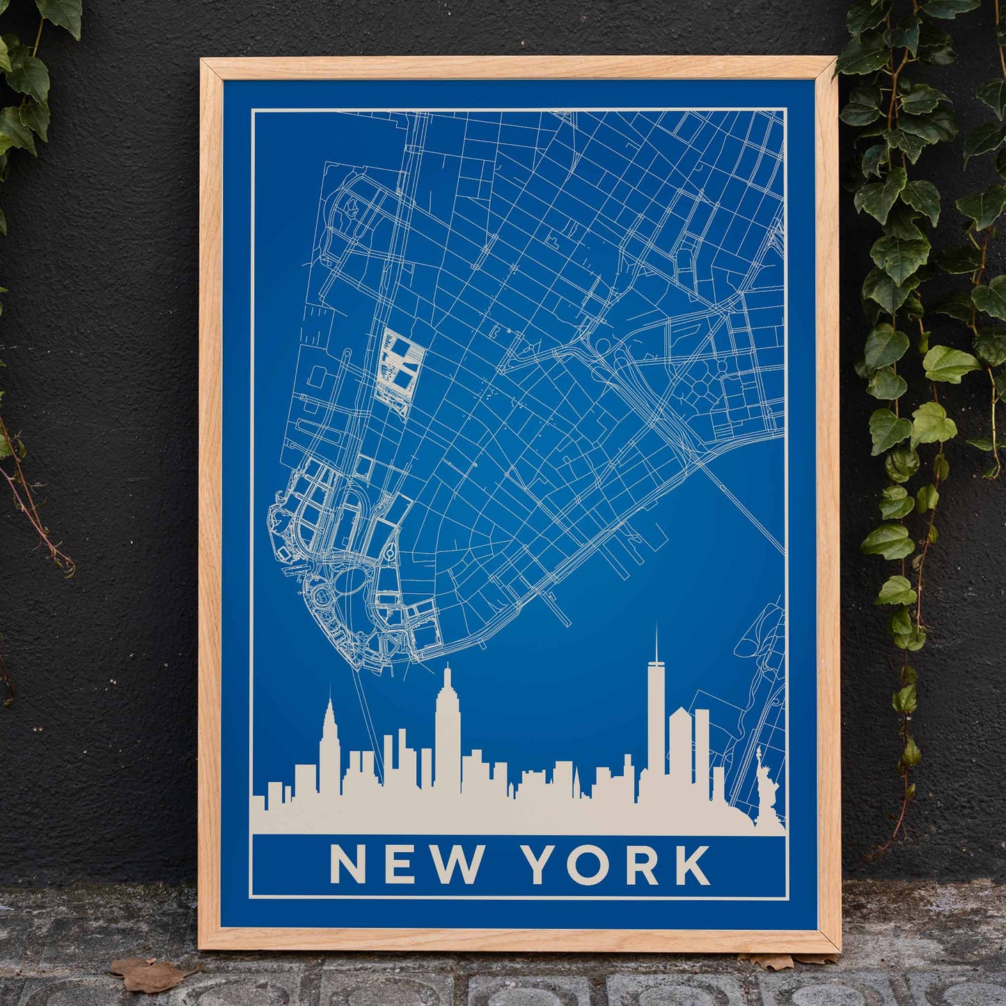 New York Minimalist Map poster by artist New York featuring a blue and white outline of New York City streets above a city skyline silhouette, framed and displayed in home decor