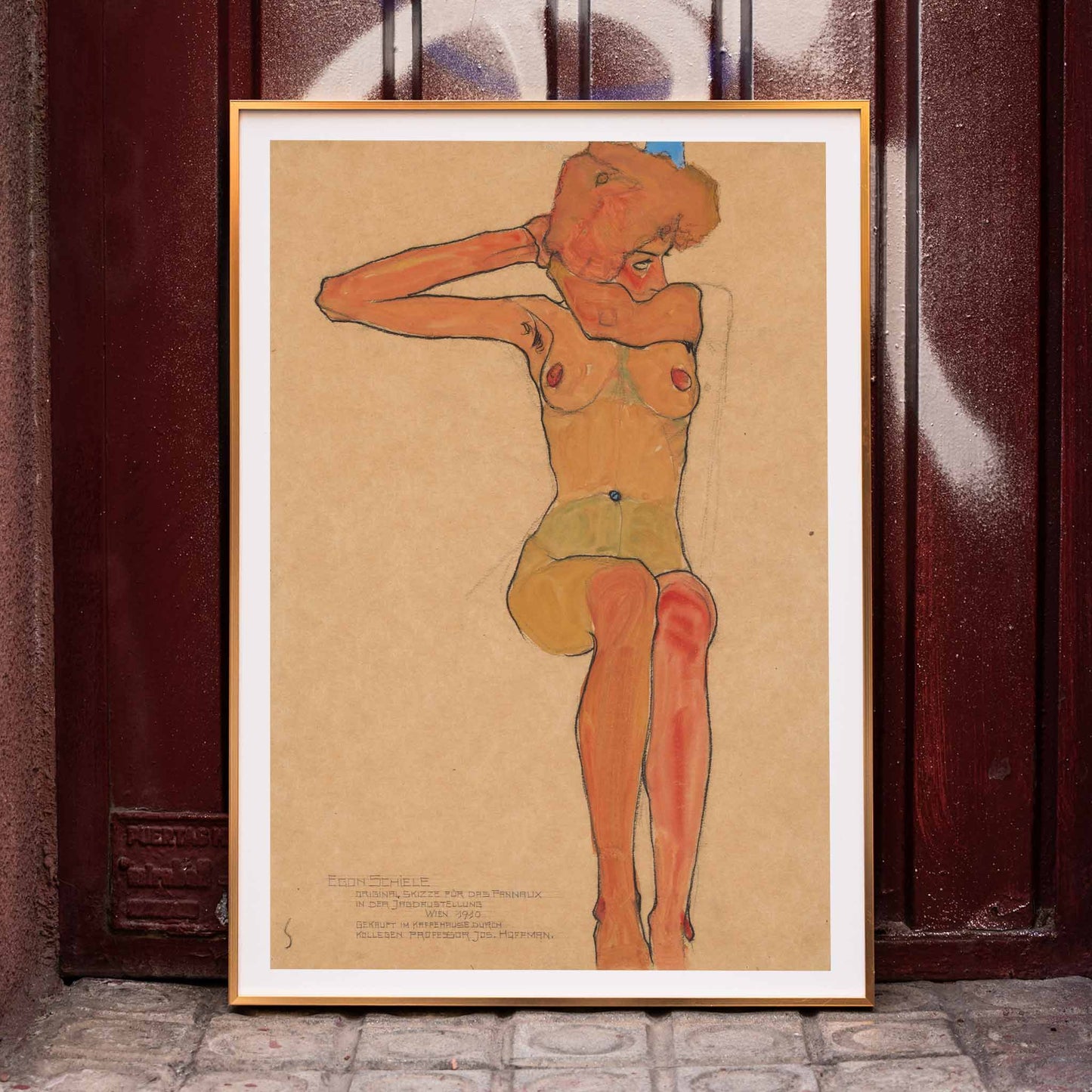 Seated female nude in expressive style Mädchenakt Gertrude by Egon Schiele poster featuring a nude figure in a seated pose with expressive lines and color, framed and displayed in home decor