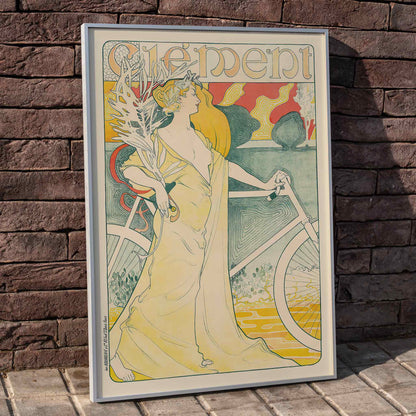 Art Nouveau poster of elegant woman in flowing gown holding bicycle by Arthur Foache Clement, framed and displayed in home decor