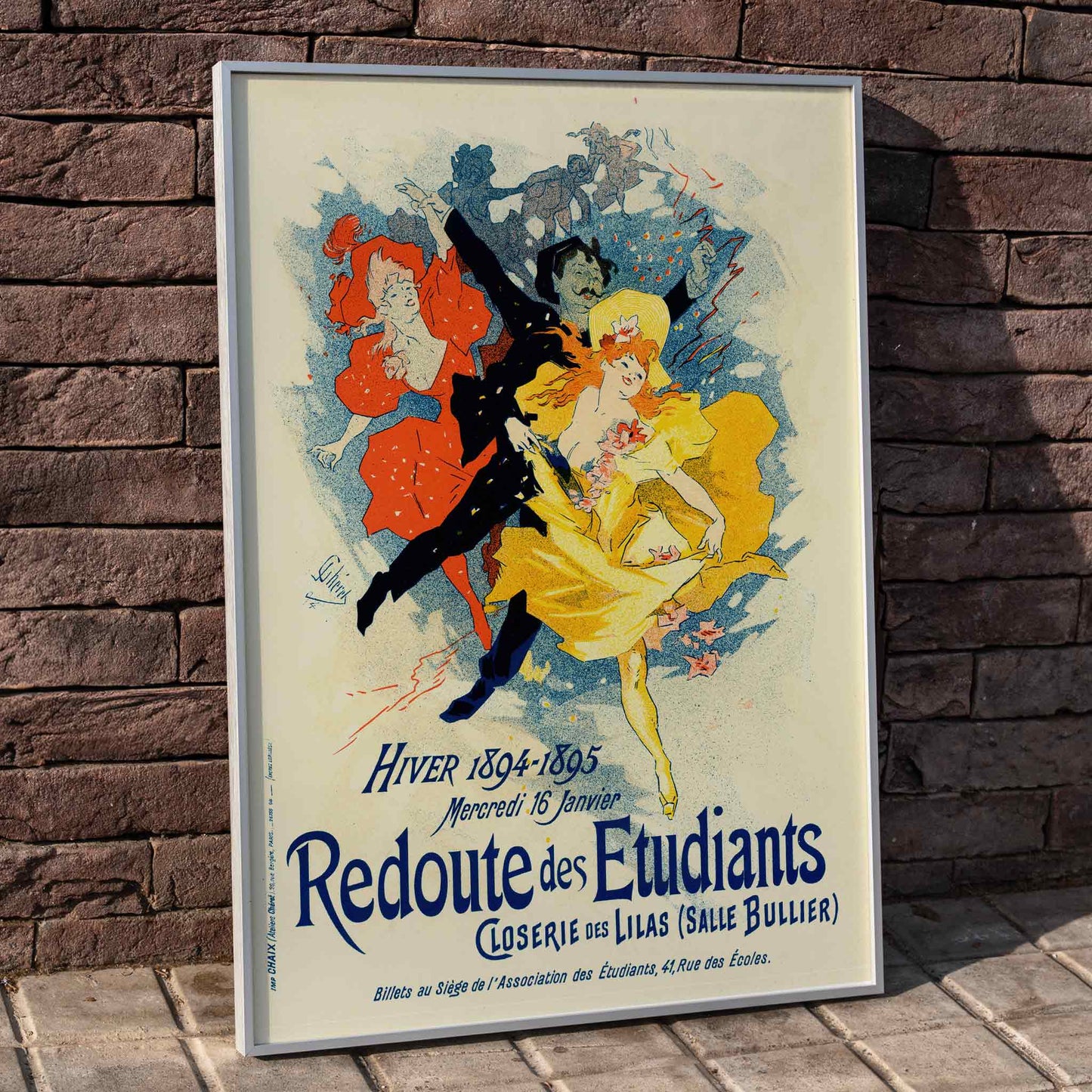 Colorful dancers in festive attire and vibrant costumes featured in Redoute Des Etudiants by Jules Cheret vintage poster with bold text, framed and displayed in home decor