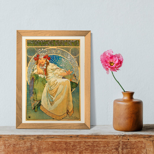 Art Nouveau poster of Princess Hyacinta in flowing gown with crown and floral accents by Alfons Mucha, framed and displayed in home decor