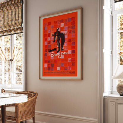 Abstract red and black Saint Joan Movie poster by Saul Bass with stylized figure on checkered background and abstract red squares, framed and displayed in home decor