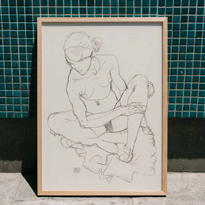 Egon Schiele Seated Nude Woman poster with delicate black linework on minimalist white background, framed and displayed in modern living room decor