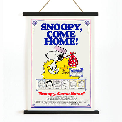Snoopy Come Home movie poster by Charles Schulz featuring Snoopy Woodstock Lucy and Charlie Brown in colorful Peanuts illustration, with wooden magnetic frame on white background