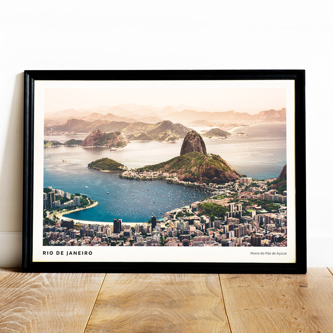Aerial view of Rio de Janeiro with beaches buildings boats blue waters and mountains including Morro do Pao de Acucar poster artwork, framed and displayed in home decor