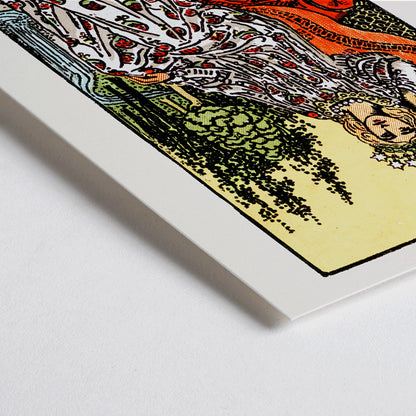 Closeup detail of The Empress Tarot card by Rider Waite featuring a crowned woman seated on a throne in a lush natural setting holding a scepter with a crown of stars