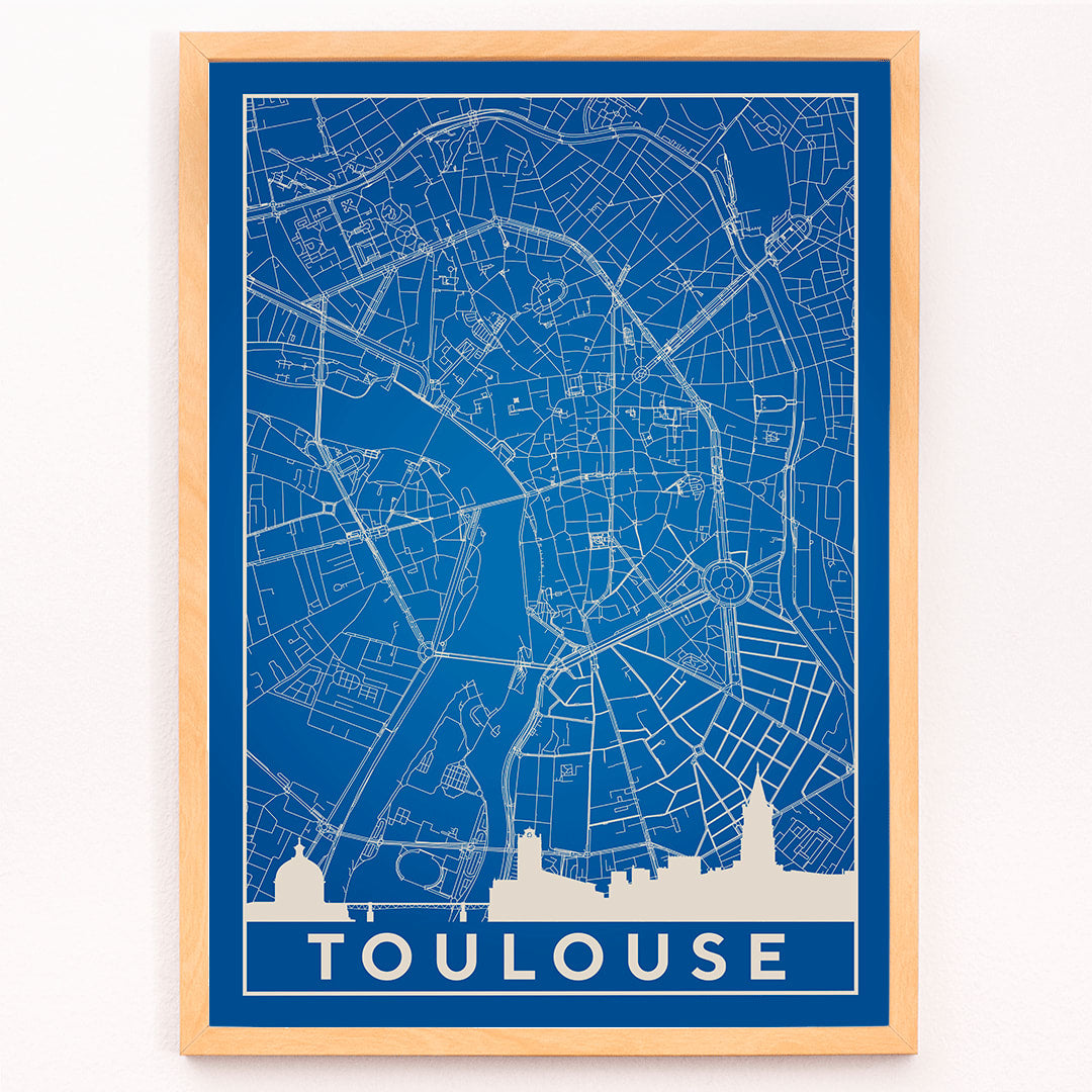 Blue and white minimalist map of Toulouse poster with white building silhouettes at the bottom modern wall art titled Minimalist Toulouse Map, framed and displayed in modern living room decor