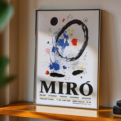 Twilights Ring exhibition poster inspired by Joan Miro featuring abstract artwork with bold colors and shapes, framed and displayed in modern living room decor